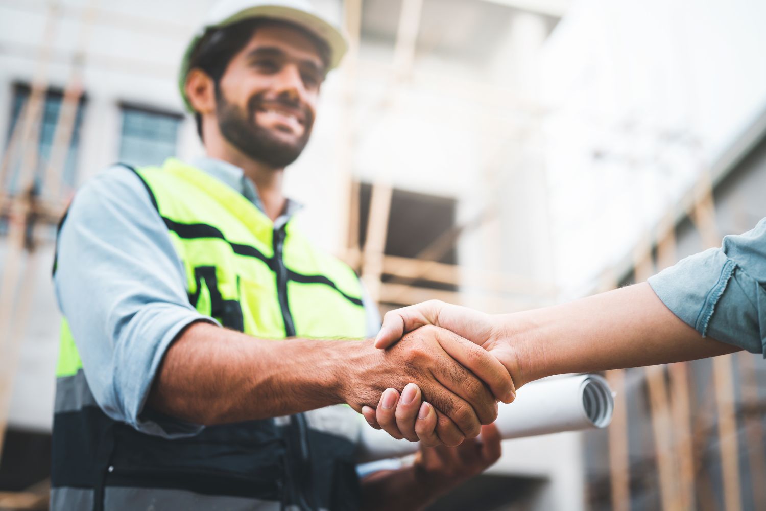 construction workers shaking hands